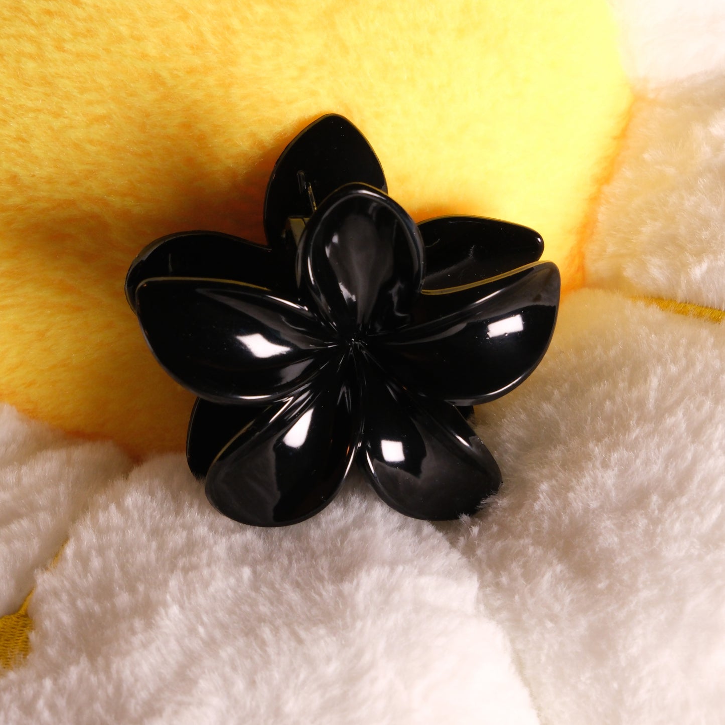 KapKap juoda gėlytė